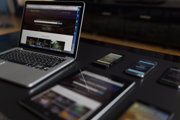 A desktop computer displaying a website design on screen